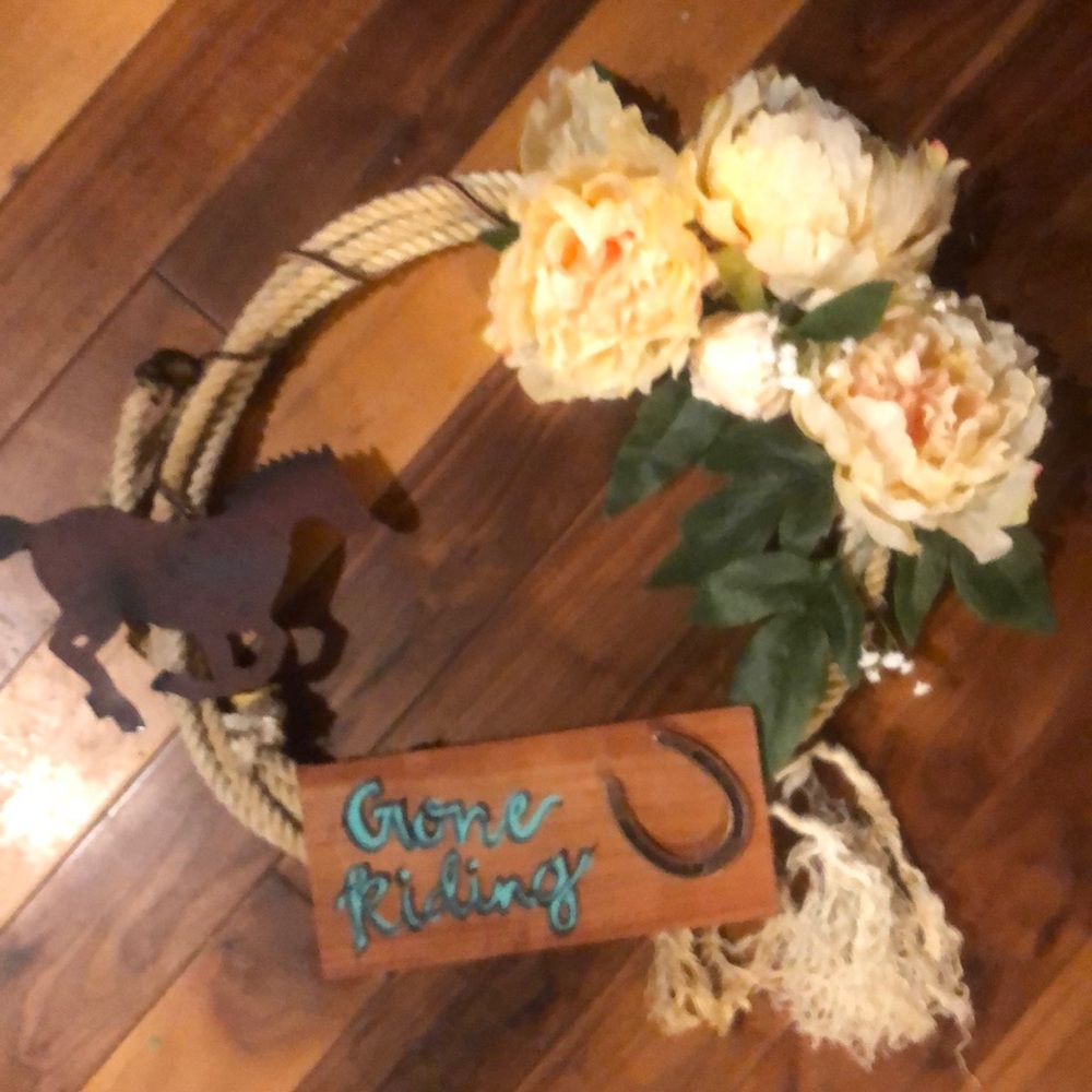 Beautiful “Gone Rinding” wreath made of real rope. farm/western decor